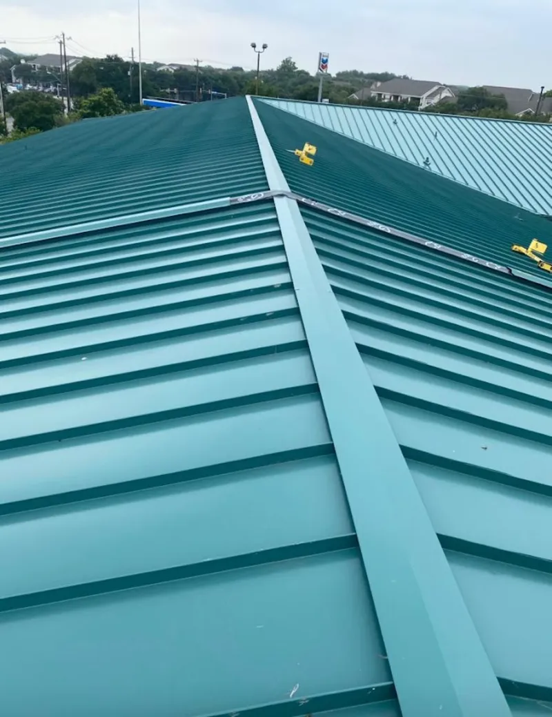 Green commercial metal roof ridge and valley for Metal Roof Repair in Ashwaubenon